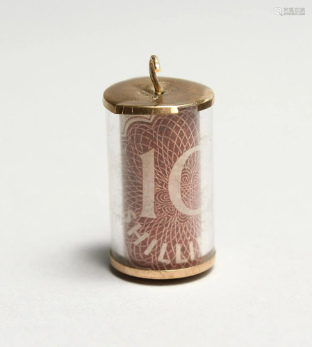 A TEN SHILLING NOTE PENDANT.