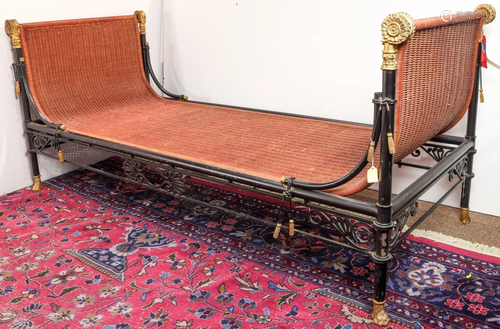 An Empire style parcel-gilt and ebonized cast-iron