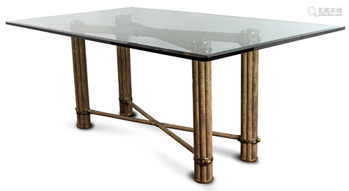 A Contemporary dining table having a beveled glass top