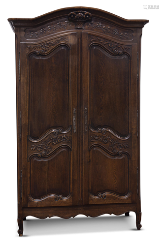 A French Provincial oak armoire