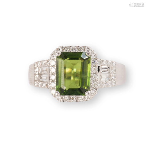A green sapphire, diamond and platinum ring