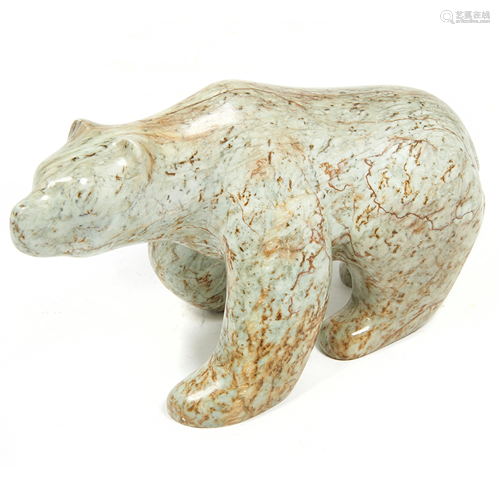 An Inuit sculpture of a running bear by Ben Henry