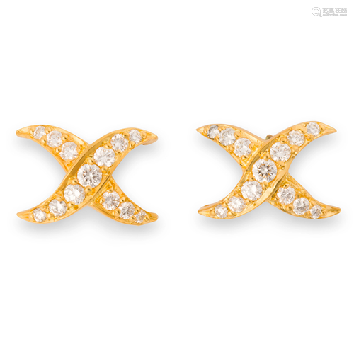 A pair of diamond and eighteen karat gold stud earrings