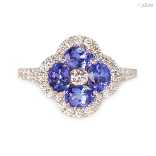 A tanzanite, diamond and fourteen karat white gold ring