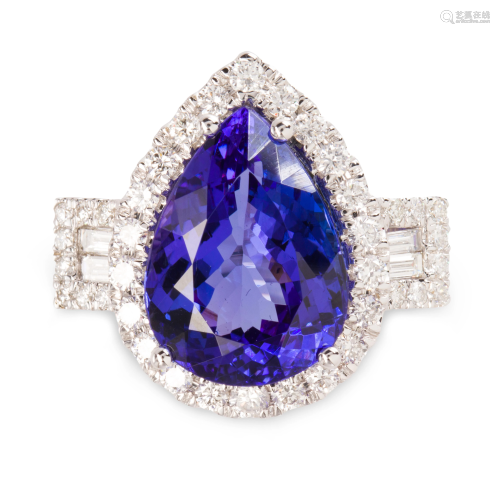 A tanzanite, diamond and fourteen karat white gold ring