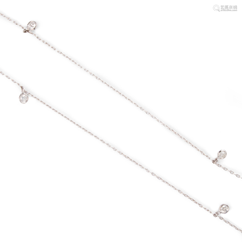 A diamond and fourteen karat white gold necklace