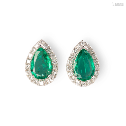 A pair of emerald, diamond and eighteen karat white