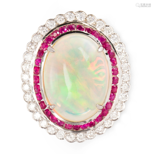 An opal, ruby, diamond and fourteen karat gold ring