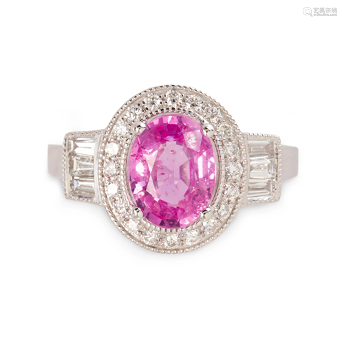 A pink sapphire, diamond and platinum ring