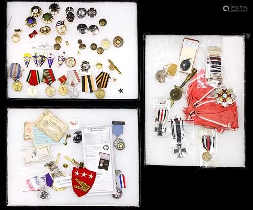 Collection of Russian military medals, badges, and pins