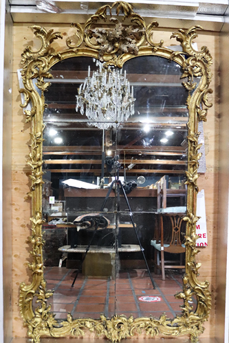 A monumental giltwood carved pier mirror in the Rococo