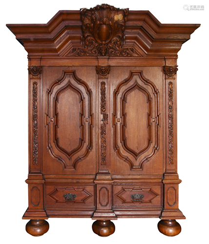 A Continental carved two door Schronk or Cabinetto