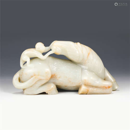 A CHINESE CARVED JADE RECUMBENT STEED DECORATION/QING DYNAST...