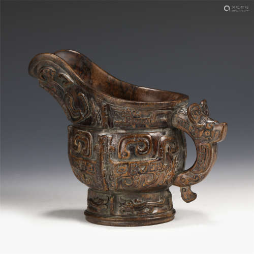A CHINESE CARVED AGARWOOD LIBATION CUP/QING DYNASTY