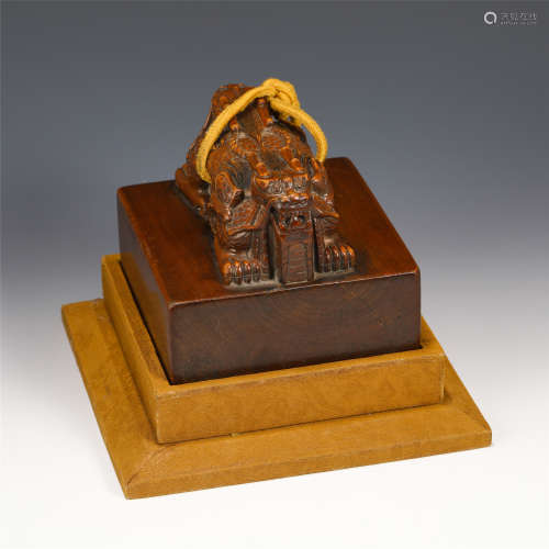 A CHINESE CARVED TANXIANG WOOD SQUARE SEAL WITH FOO-DOG KNOB...