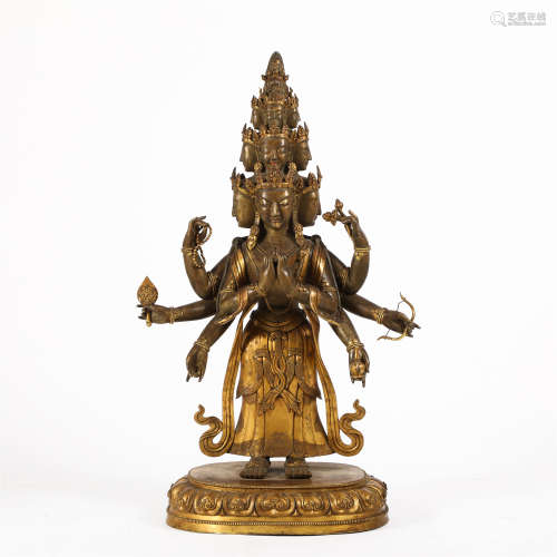A CHINESE GILT BRONZE FIGURE OF EIGHT ARMS STANDING BUDDHA /...
