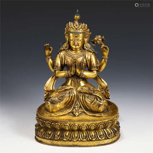 A CHINESE GILT BRONZE FIGURE OF FOUR ARMS SEATED GUANYIN STA...