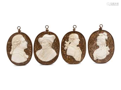 A Set of Four Iron-Framed Carved Marble Portrait
