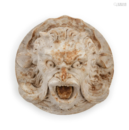 A Continental Carved Stone Grotesque Mask