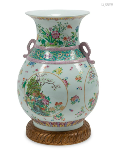 A Chinese Export Style Porcelain Vase on a Carved