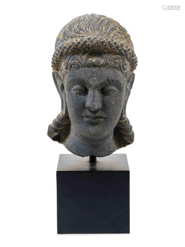 A Life Size Gandharan Grey Schist Head of the Goddess