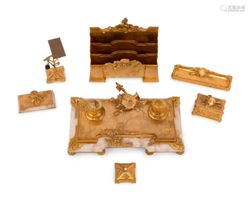 A French Gilt Bronze and Onyx Seven-Piece Desk Set by