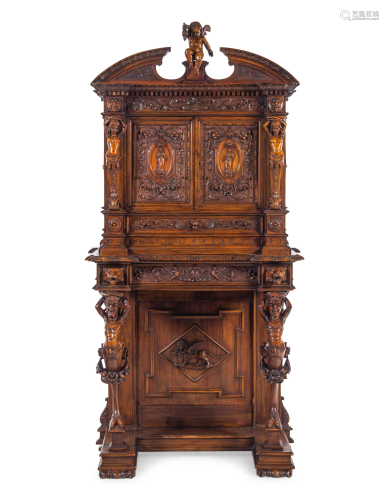 A Renaissance Revival Carved Walnut Cabinet on Stand