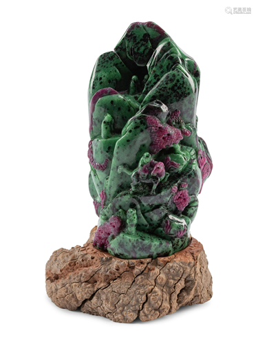 A Chinese Carved Ruby Zoisite Boulder on a Wood Base