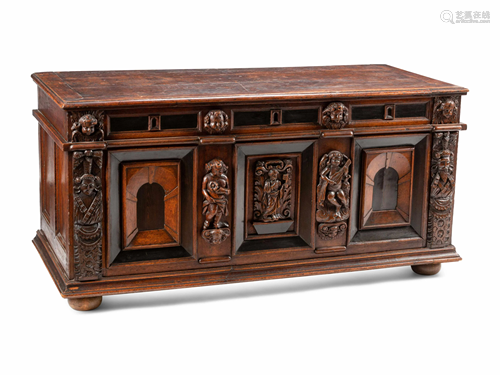 An Italian Carved Oak and Walnut Cassone