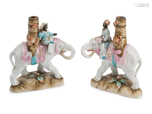 A Pair of Continental Porcelain Figural Candlesticks