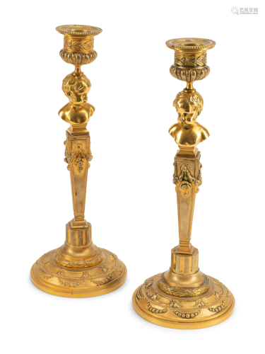 A Pair of Continental Gilt Metal Candlesticks with