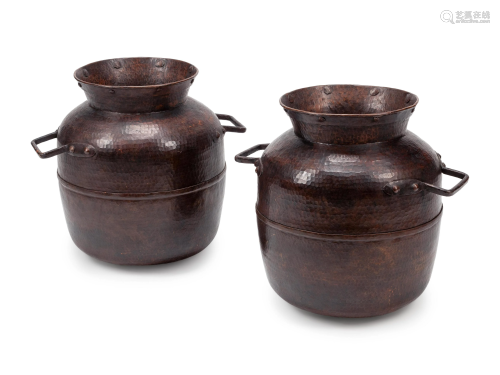 A Pair of Large Iron Mounted Hammered Metal Jars