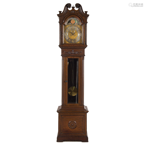 A Carved Oak Tall Case Clock