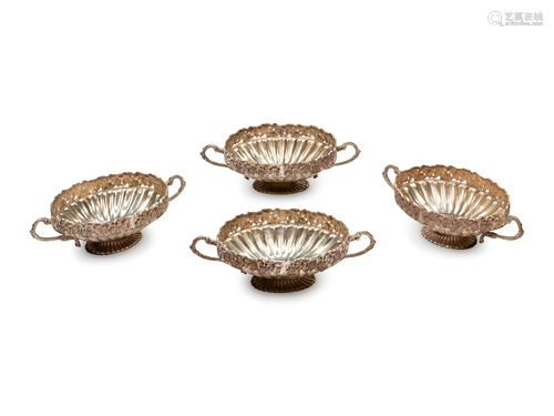 A Set of Four Silver-Plate Handled Dishes