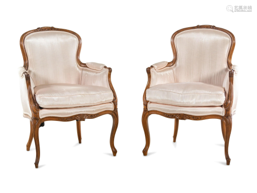 A Pair of Louis XV Style Walnut Bergeres