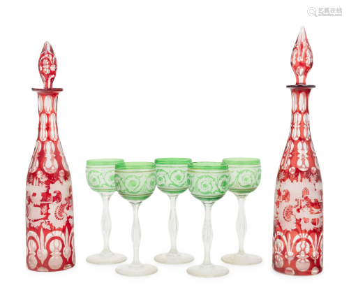 A Pair of Bohemian Glass Decanters with Five Associated