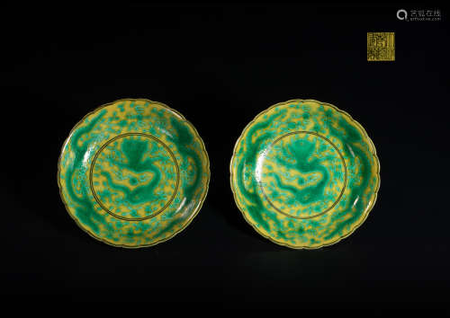 A pair of plate  With yello W bottom and dragon pattern from...