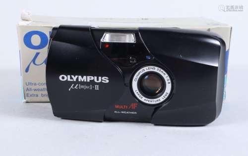 An Olympus mju II Compact Camera, serial no 70696713, powers...