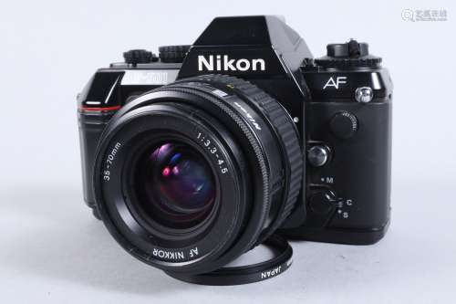 A Nikon F 501 SLR Camera, serial no 5193669, powers up, shut...