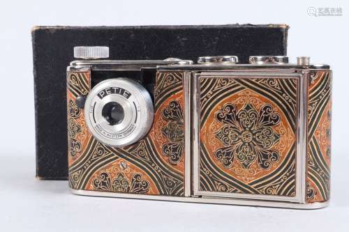 A Walter Kunik Petie Vanity Camera, chrome, gold, brown gree...