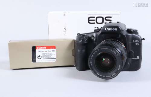 A Canon EOS 30 SLR Camera, serial no 71003702, body G, sligh...