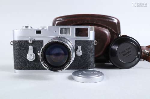 A Leica M2 Camera, chrome, serial no 1085 642, 1961, self ti...
