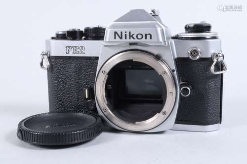 A Nikon FE2 Camera body, chrome, serial no 2023038, shutter ...