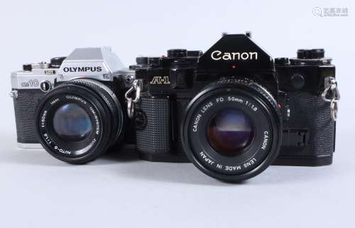 A Canon A1 and an Olympus OM10 SLR Cameras, A1 serial no 967...