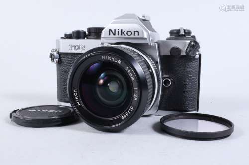 A Nikon FM2 SLR Camera, chrome, serial no 7206888, shutter w...