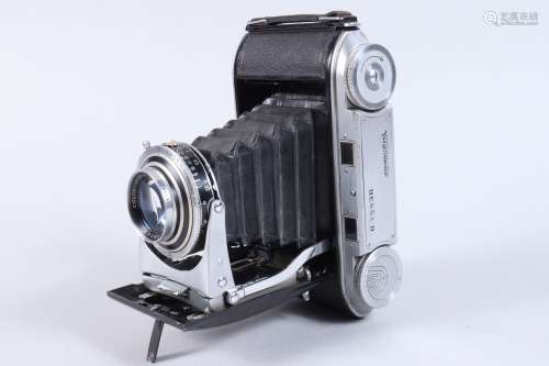 A Voigtländer Bessa II Folding Camera, shutter working, door...