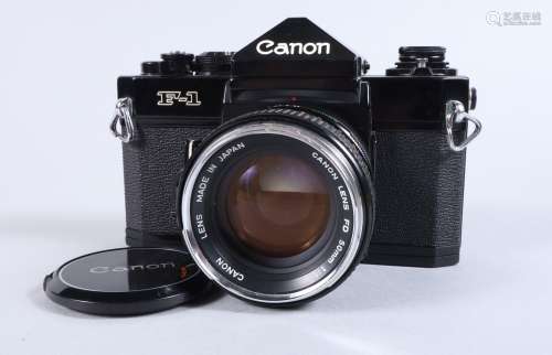 A Canon F 1n SLR Camera, black, serial no 596975, shutter wo...