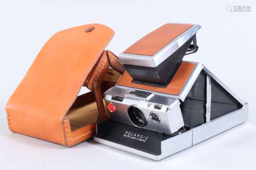 A Polaroid SX 70 Land Camera, brown, untested, viewfinder cl...