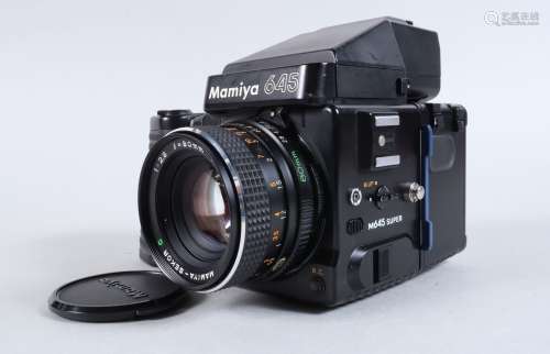 A Mamiya 645 Super Camera, serial no 223416, with power grip...