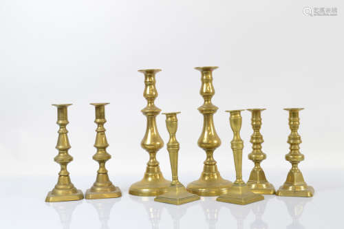 Four pairs of Georgian and later brass candlesticks, includi...